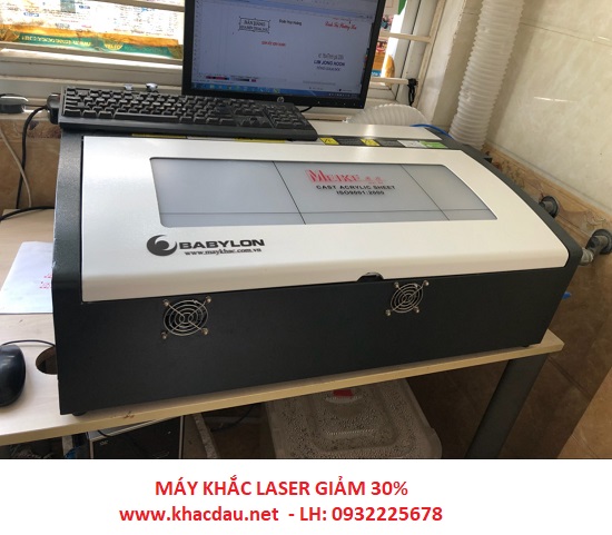 may khac dau laser